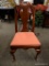 (R2) MAHOGANY DINING CHAIR WITH RED UPHOLSTERED SEAT. MEASURES 20 IN X 19 IN X 39 IN. ITEM IS SOLD