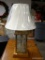 (R2) HAND ENGRAVED GLASS LAMP WITH WOODEN BASE AND WHITE CLOTH SHADE. HAS HARP AND FINAL. MEASURES