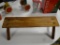 (R3) PINE LOG MADE DOLL BENCH. MEASURES 24 IN X 10 IN X 6.5 IN. ITEM IS SOLD AS IS WHERE IS WITH NO