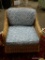 (R3) WICKER ARM CHAIR WITH BLUE FLORAL UPHOLSTERED CUSHIONS. IS 1 OF A PAIR. MEASURES 29 IN X 35 IN
