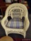 (R3) WICKER ARM CHAIR WITH PLAID UPHOLSTERED CUSHION. MEASURES 29 IN X 29 IN X 35 IN. ITEM IS SOLD