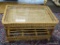 (R3) WICKER AND GLASS TOP COFFEE TABLE. MEASURES 27 IN X 24 IN X 20 IN. ITEM IS SOLD AS IS WHERE IS