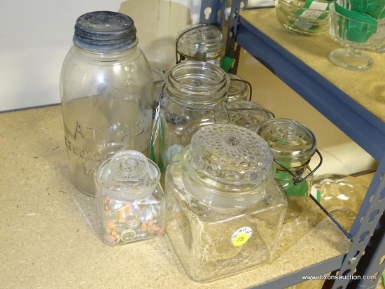 (R2) LOT OF ASSORTED GLASS JARS. ALL HAVE LIDS (SOME WITH LOCKING CAPABILITIES). ITEM IS SOLD AS IS