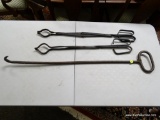 (R2) 3 PIECE FIREPLACE TOOL LOT TO INCLUDE A POKER AND 2 PAIR OF TONGS. ITEM IS SOLD AS IS WHERE IS