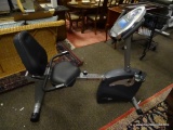 (R2) SCHWINN EXERCISE BIKE WITH DIGITAL DISPLAY AND BUILT IN FAN. ITEM IS SOLD AS IS WHERE IS WITH