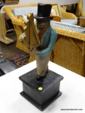 (R2) STATUE OF A MAN WITH A SEXTANT. MEASURES APPROXIMATELY 7 IN X 7.5 IN X 21 IN. ITEM IS SOLD AS