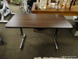 (R2) WOOD AND METAL 4 FT TABLE. MEASURES 4 FT X 2 FT X 2 FT 5 IN. ITEM IS SOLD AS IS WHERE IS WITH
