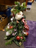 (R2) 2 FT 5 IN TALL CHRISTMAS TREE WITH SANTA FACE ACCENT. ITEM IS SOLD AS IS WHERE IS WITH NO