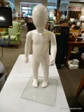 (R2) CHILD SIZE MANNEQUIN ON GLASS STAND. MEASURES APPROXIMATELY 29 IN TALL. ITEM IS SOLD AS IS