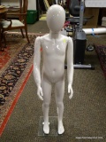 (R2) YOUTH SIZE MANNEQUIN ON GLASS STAND. MEASURES APPROXIMATELY 42 IN TALL. ITEM IS SOLD AS IS