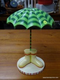 (R2) UMBRELLA AND BOOTS THEMED DISPLAY. MEASURES 16 IN TALL. ITEM IS SOLD AS IS WHERE IS WITH NO