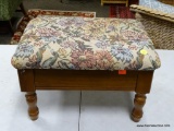 (R2) MAHOGANY LIFT TOP FOOTSTOOL WITH FLORAL CROSS-STITCHED UPHOLSTERY. MEASURES 15 IN X 11 IN X 10