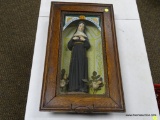 (R2) SAINT RITA OF CASCIA SHADOWBOX FRAMED FIGURINE. MEASURES 13 IN X 22.5 IN. ITEM IS SOLD AS IS
