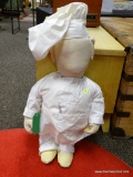 (R2) CLOTH CHEF STYLE DOLL. MEASURES APPROXIMATELY 23 IN TALL. ITEM IS SOLD AS IS WHERE IS WITH NO