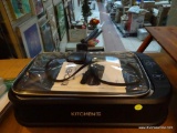(R3) KITCHEN HQ LIDDED GRIDDLE WITH POWER CORD AND PAPERWORK. ITEM IS SOLD AS IS WHERE IS WITH NO