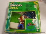 (R3) SNOOPY & FRIENDS TRAIN SET. IS IN BOX. MISSING 1 CAR AND 2 SIGNS. ITEM IS SOLD AS IS WHERE IS