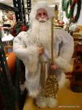 (R3) LARGE SANTA CLAUS IN AN ALL WHITE OUTFIT WITH A RED BAG OF HOLLY BERRIES. MEASURES 37 IN TALL.