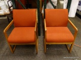 (R3) SET OF 4 OAK AND RED UPHOLSTERED ARM OFFICE CHAIRS. EACH MEASURES 22 IN X 27 IN X 32 IN. ITEM