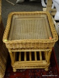 (R3) WICKER AND GLASS TOP END TABLE. MEASURES 19 IN X 21 IN X 20 IN. ITEM IS SOLD AS IS WHERE IS