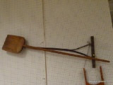 (R3) 2 PIECE LOT TO INCLUDE AN ANTIQUE RAKE AND WOODEN CARVED SHOVEL. ITEM IS SOLD AS IS WHERE IS