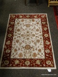 (R3) BURGUNDY AND CREAM FLORAL AREA RUG. MEASURES 3 FT 3 IN X 4 FT 8 IN. ITEM IS SOLD AS IS WHERE IS
