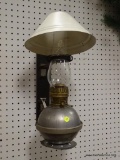 (R3) WALL HANGING OIL LAMP WITH METAL SHADE AND GLASS CHIMNEY. MEASURES APPROXIMATELY 18 IN TALL.