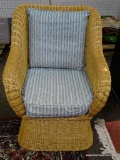 (R3) WICKER ARM CHAIR WITH BLUE STRIPE UPHOLSTERED CUSHIONS. IS 1 OF A PAIR. MEASURES 29 IN X 36 IN