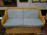 (R3) WICKER LOVESEAT WITH BLUE STRIPE UPHOLSTERED CUSHIONS. IS 1 OF A PAIR. MEASURES 70 IN X 38 IN X