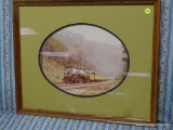 (R3) FRAMED PRINT OF A TRAIN WITH OVAL MATTING. MEASURES 22 IN X 18 IN. ITEM IS SOLD AS IS WHERE IS