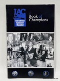 (4D) SIGNED IAC 25TH ANNIVERSARY INTERNATIONAL AUCTIONEERS CHAMPIONSHIP BOOK OF CHAMPIONS, MOST