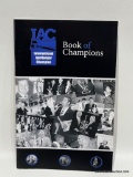 (5E) SIGNED 25TH ANNIVERSARY IAC INTERNATIONAL AUCTIONEERS CHAMPIONSHIP BOOKLET BOOK OF CHAMPIONS,