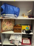 SHELF LOT: CONTENTS OF THREE SHELVES INCLUDING: MICKEY MOUSE POOL, TEA CADDY, THROW PILLOWS, KNICK