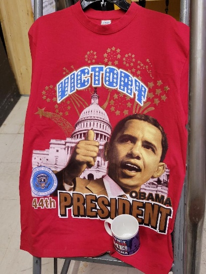 OBAMA SHIRT AND COFFEE MUG - SHIRT HAS SIZE MED TAG - APPEAR TO BE NEW - TWO ITEMS TOTAL