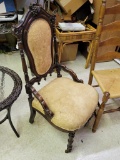 ANTIQUE VICTORIAN PARLOR CHAIR ON CASTERS - HEAVILY CARVED, GOLD UPHOLSTRY - SEAT SHOWS SOME WEAR