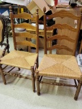 TWO LADDER BACK CHAIRS WITH RUSH SEATS - EACH MEASURES 41.5