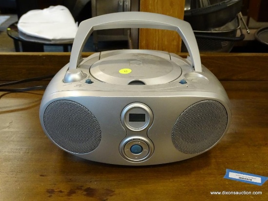 CENTER ROW FRONT - PORTABLE CD PLAYER RADIO. TRUTECH BRAND. WITH CORD. ITEM IS SOLD AS IS WHERE IS