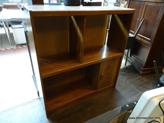 FRONT RIGHT - BOOKSHELF WITH CLOSED DOOR AT BOTTOM. APPROX 49 INCHES WIDE , 15 INCHES DEEP, 52