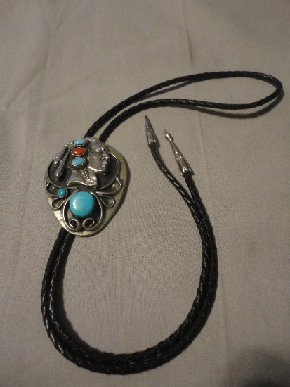 SILVER-TONE BOLO TIE WITH TURQUOISE AND CORAL ALL ITEMS ARE SOLD AS IS, WHERE IS, WITH NO GUARANTEE