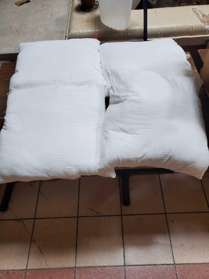 set of 4 square white pillows, see pictures for more details.