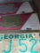 LOT OF 3 LICENSE PLATES. TO INCLUDE 2 UNITED STATES COAST GUARD PLATES AND 1 1983 GEORGIA PLATE. IS