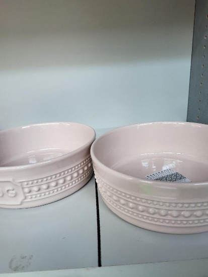 2 PINK MATCERAMICA DOG BOWLS. IS SOLD AS IS WHERE IS WITH NO GUARANTEES OR WARRANTY, NO REFUNDS OR