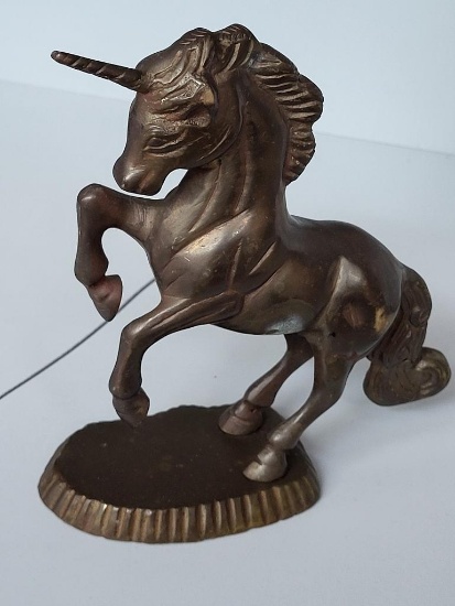 BRASS UNICORN ON A STAND MADE IN INDIA. IS SOLD AS IS WHERE IS WITH NO GUARANTEES OR WARRANTY, NO