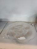 13 IN CLEAR GLASS PLATTER WITH HANDLES. IS SOLD AS IS WHERE IS WITH NO GUARANTEES OR WARRANTY, NO