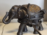 BLACK ELEPHANT WITH BRONZE TOP PLUG IN LIGHT. IS SOLD AS IS WHERE IS WITH NO GUARANTEES OR WARRANTY,