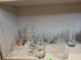 LOT OF 18 GLASSES AND 4 CLEAR GLASS PLATES. TO INCLUDE 3 WINE GLASSES, 3 REGULAR GLASSES AND 12