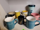 8 PIECE COFFEE MUG SET. INCLUDES BRAND NEW ALADDIN 3 PACK TUMBLER SET AND OTHER MUGS WITH VARIOUS