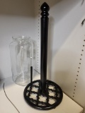 BORMIOLI ROCCO GLASS PITCHER AND BLACK PAPER TOWEL RACK. IS SOLD AS IS WHERE IS WITH NO GUARANTEES