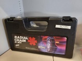 BRAND NEW RADIAL SNOW CHAIN WITH CASE. MODEL SC1034. IS SOLD AS IS WHERE IS WITH NO GUARANTEES OR