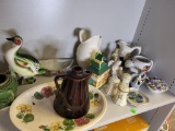 SHELF LOT. INCLUDES VARIOUS CERAMIC PIECES TO INCLUDE FIGURINES, SALT AND PEPPER SHAKER PLATE AND