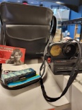 VINTAGE POLAROID CAMERA WITH CASE AND BOOKLET. CASE VELCRO SHUTS. IS SOLD AS IS WHERE IS WITH NO